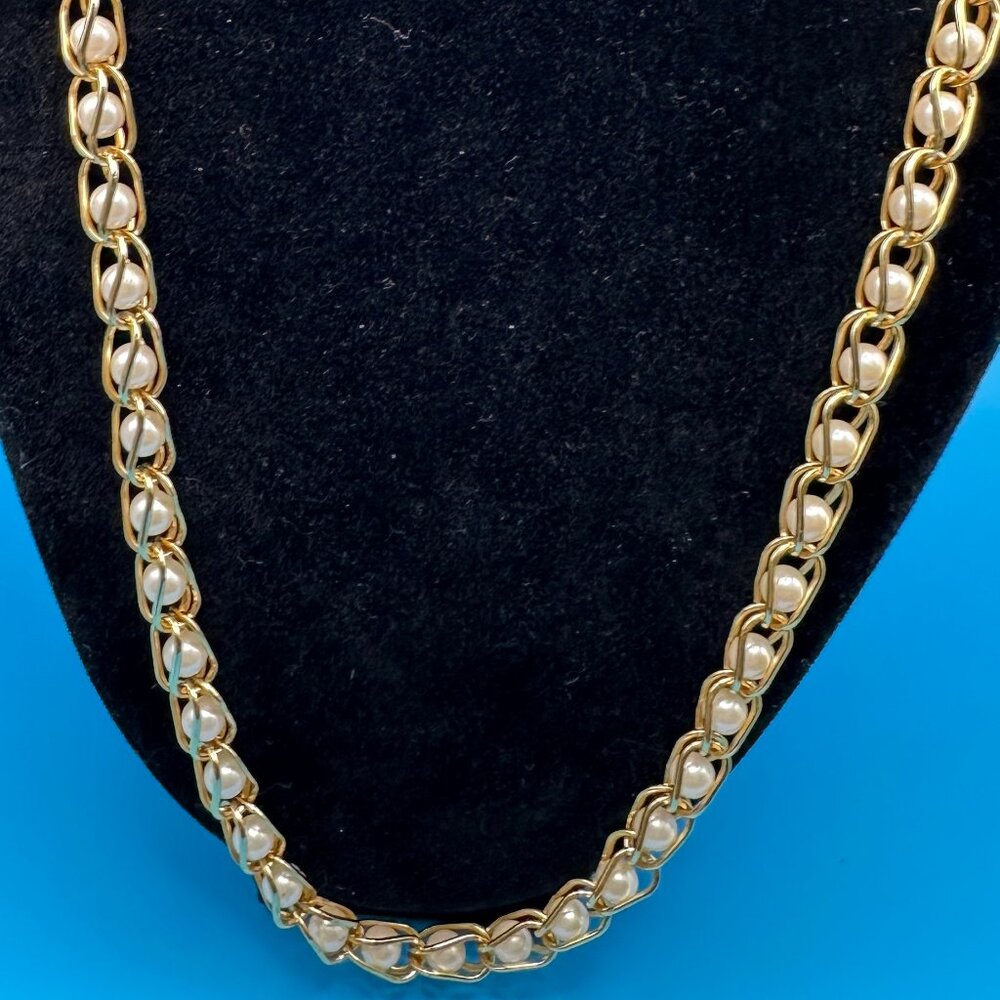 Classy gold-tone metal and faux pearl necklace.